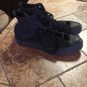 All black high top Converse